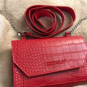 NWOT Izzy and Liv Red Crossbody Bag. It comes with two straps.